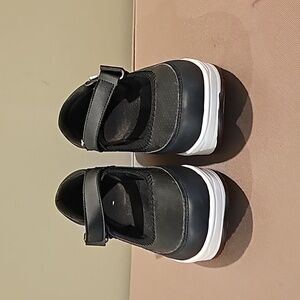 Women's black slip on rocker sole shoe  low cut